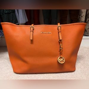 Michael Kors Leather Jet Set Travel Tote
Orange Saffiano